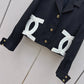 Chanel-style cropped black blazer
