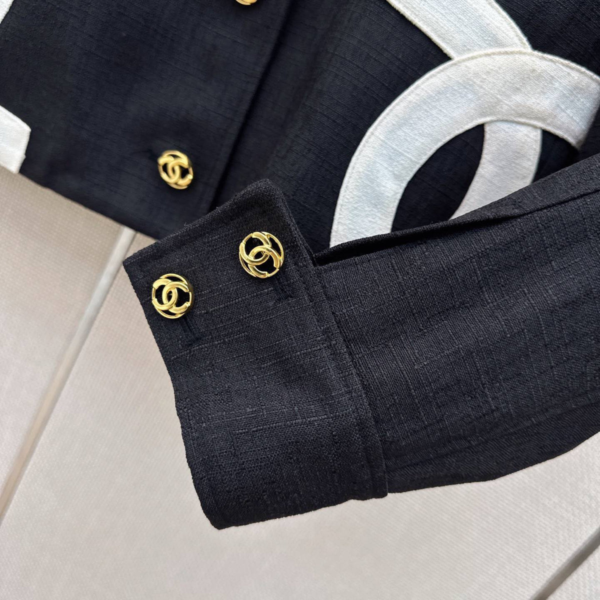 Chanel-style cropped black blazer